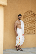 Man wearing a thilani printed white cotton dhoti with uparana