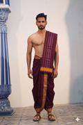 Man wearing a traditional gold zari border maroon cotton dhoti with uparana