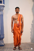 Man wearing a traditional woven border orange cotton dhoti with matching khes