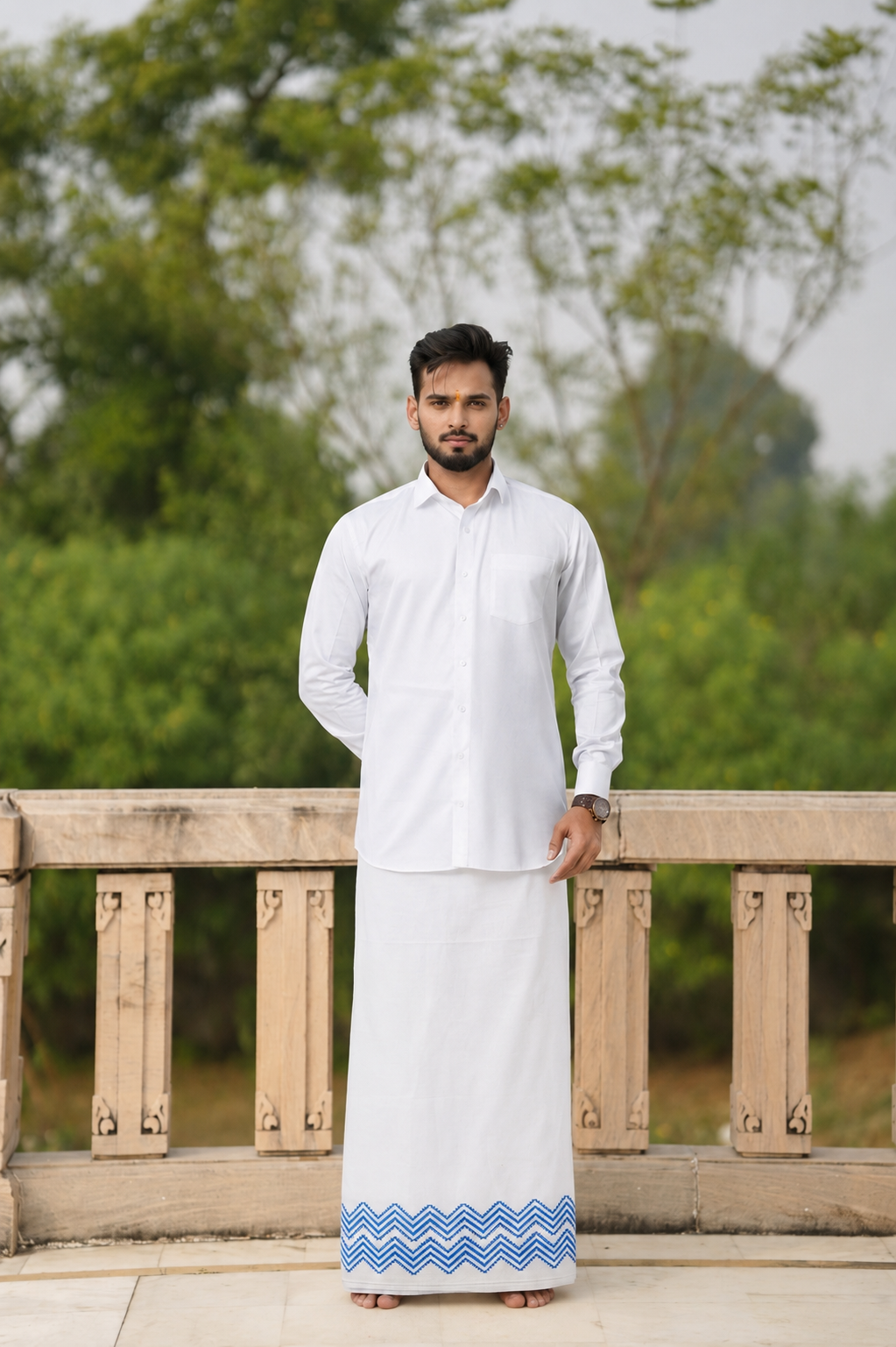 Man wearing a zigzag design border white dhoti and shirt combo